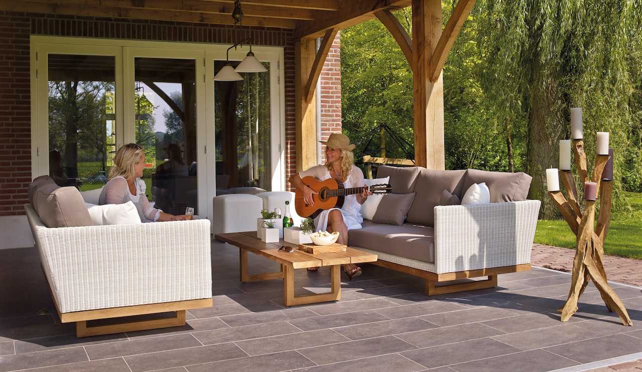 Two people on sitting on a patio